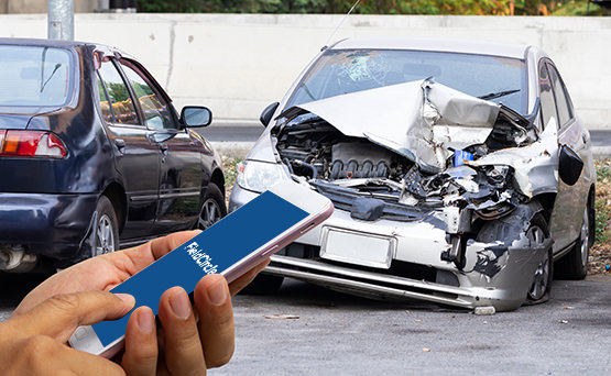 Individual using FieldCircle mobile app inspecting a car accident